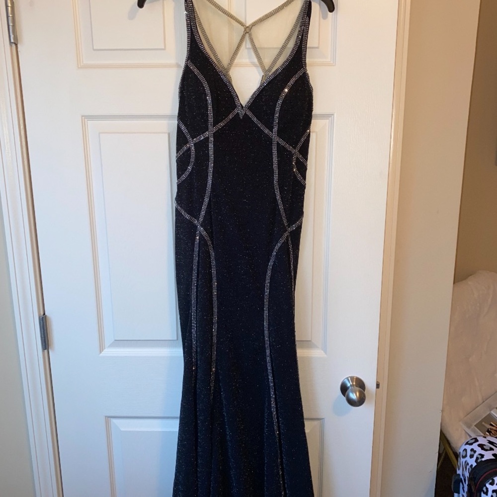 Black long formal gown. Perfect condition. Only worn once for a few hours.